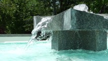 Slow motion of a large granite water fountain.