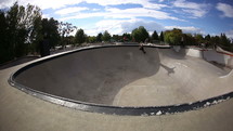 skateboarder doing tricks at a skate park 