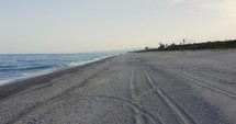 calm empty beach before summer season near the ocean