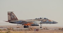 Armed Israeli Air Force F15 fighter planes taking off with full afterburner