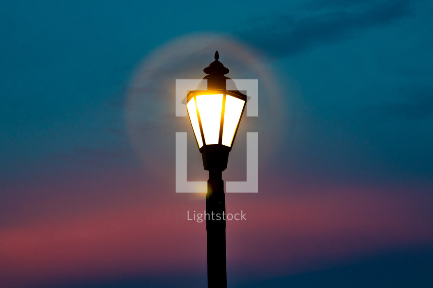 street lamp on sunset sky background