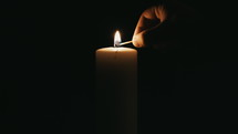 lighting a candle in darkness 