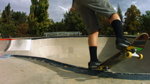 skateboarder doing tricks at a skate park 