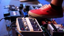 feet on guitar pedals 