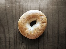 a bagel against wood background
