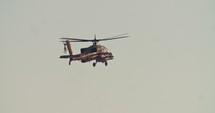 Israeli Air Force Apache Longbow military helicopter attacking targets with canon