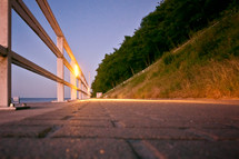 railing along a walkway along a shore 
