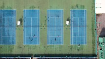 Tennis players play on the tennis courts