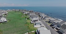 Drone flying by buildings at the Ocean