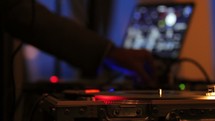 a DJ at a turntable 