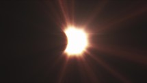 Rays of sun-light, moon covering the sun during Total Solar Eclipse.	