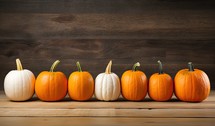 Pumpkins on wooden background with copy space for your text.