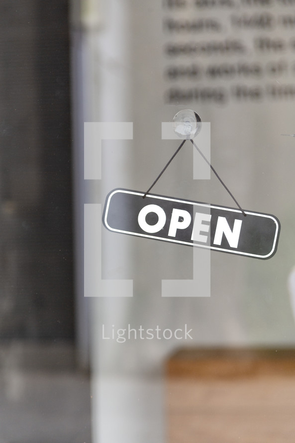 open sign on a window 