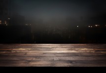 Empty wooden table in front of a city at night. Ready for product display montage