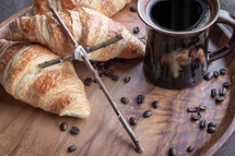 rustic cross, coffee and croissants 