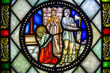 stained glass window  of Jesus praying 
