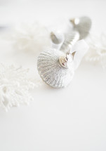 glittery silver Christmas ornament on white background 