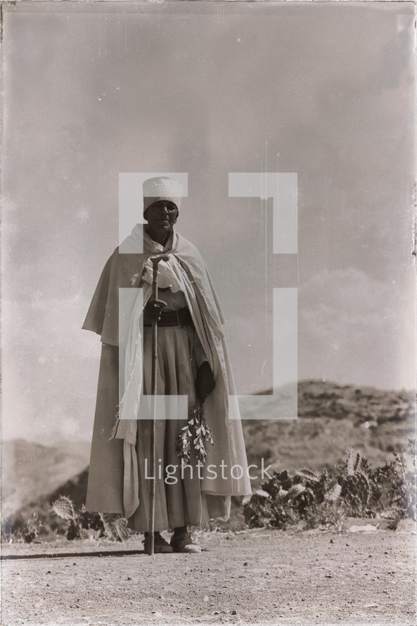 mountain priest walking in Africa 