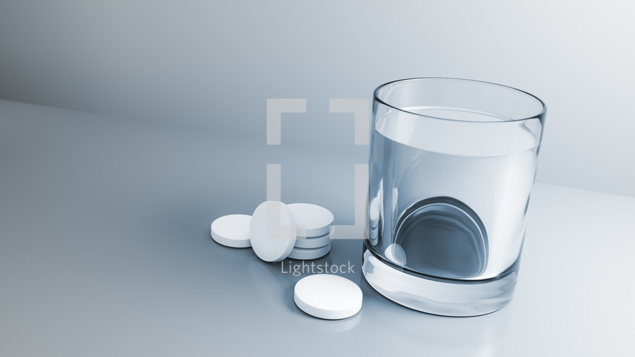 tablets and a glass of water 
