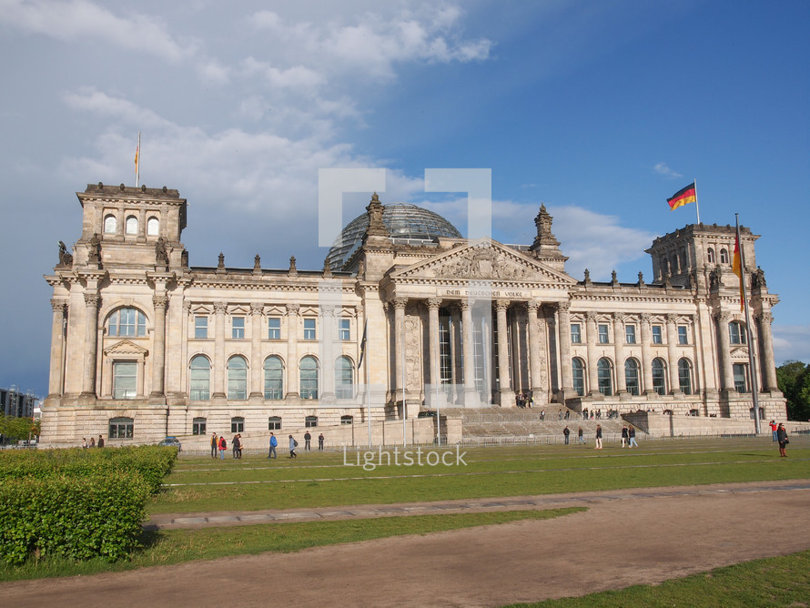BERLIN, GERMANY - MAY 11, 2014: Tourists visiting the Reichstag (German Parliament) in Tiergarten Park