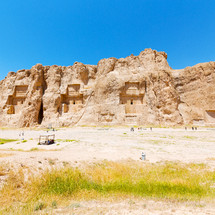 ruins carved into a mountainside in Iran 