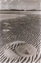 ripples in sand on a beach 