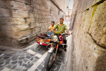 Motorcycle on the narrow streets of old Ottoman district in Shanli Urfa