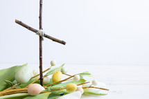 cross of sticks and Easter eggs branches 