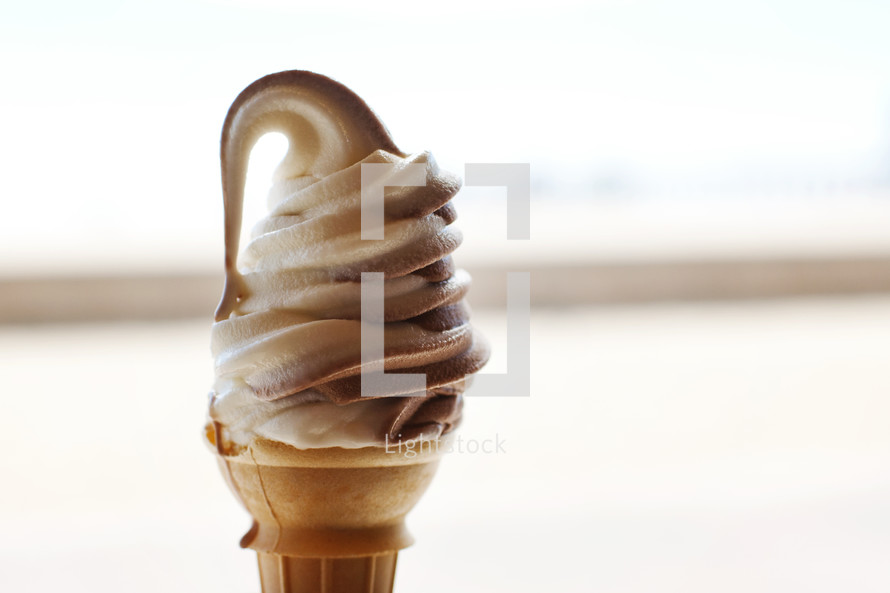 vanilla and chocolate swirl ice cream cone 