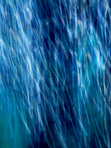 Light trails on blue suggesting rain; easily used vertically or horizontally