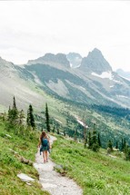 woman backpacking on a mountain trail 