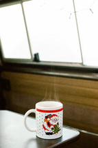 steam rising from a Santa coffee mug 