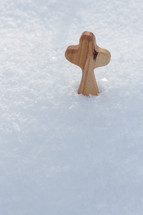 wooden cross in snow 