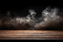 Smoke on a wooden table in front of a black background.