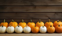 Pumpkins on wooden background with copy space for your text.