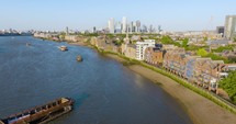 Aerial View Over River Thames And Canary Warf And Surrounding Architecture