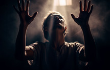 Person with hands raised in worship