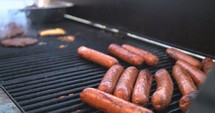 hotdogs on a grill 