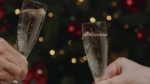 Champagne toast for new year event against the tree