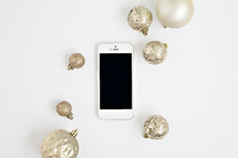 iphone and gold Christmas ornaments 