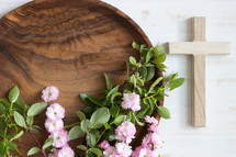 blossoms and teak tray and cross on white
