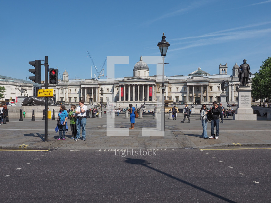 LONDON, UK - JUNE 11, 2015: Tourists visiting Trafalgar Square in front of the National Gallery