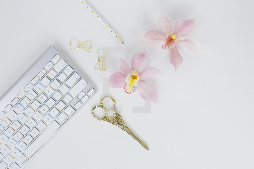 eiffel tower, gold, clips, scissors, keyboard, pencils, keypad, computer, desk, white background orchids, pink 