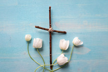 anemone flowers and cross made of sticks 