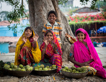 children waving in India 