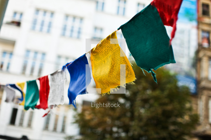 Colorful flags hanging from buildings