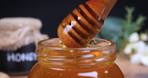 Honey poured on spoon in slow motion. 