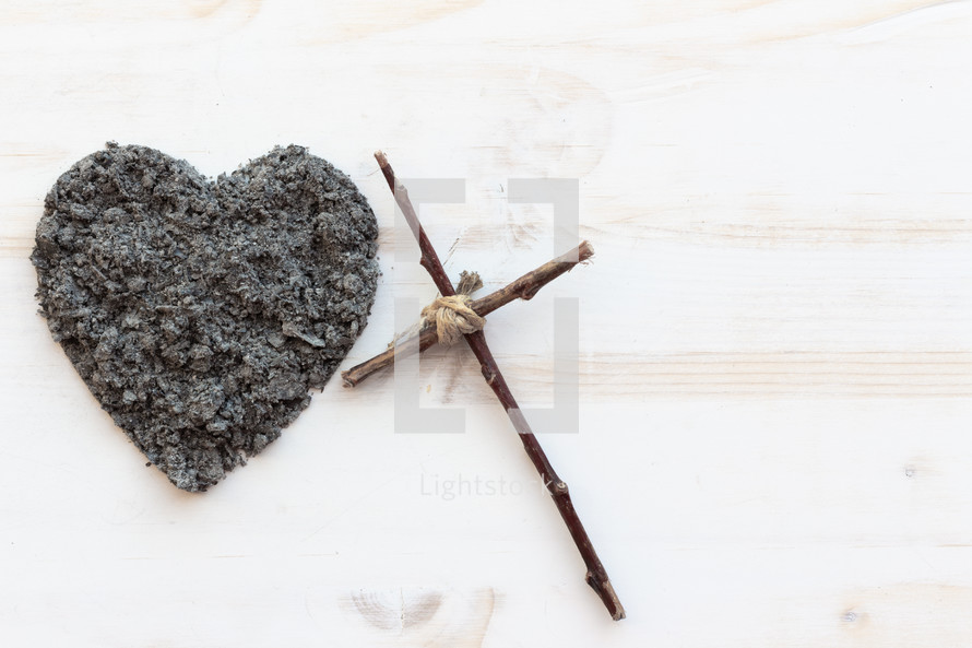 cross in heart shaped ashes 