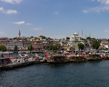 view of Rüstem Paşa Camii and ferry boats in Istanbul, Turkey 