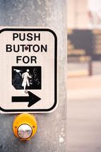 "Push to Walk" street sign on a metal pole.